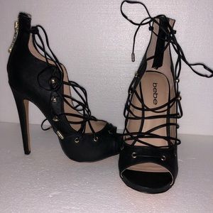 BEBE Black strappy heel.